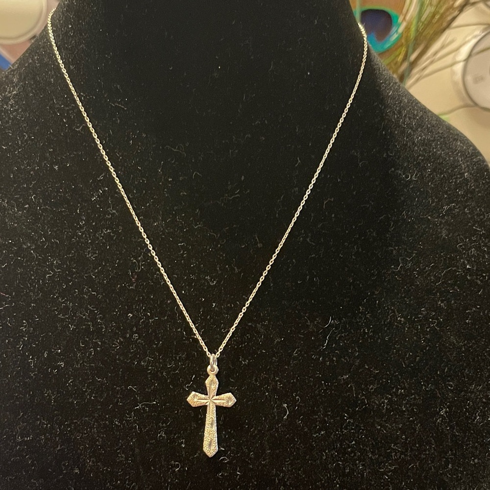 Silver cross pendant.